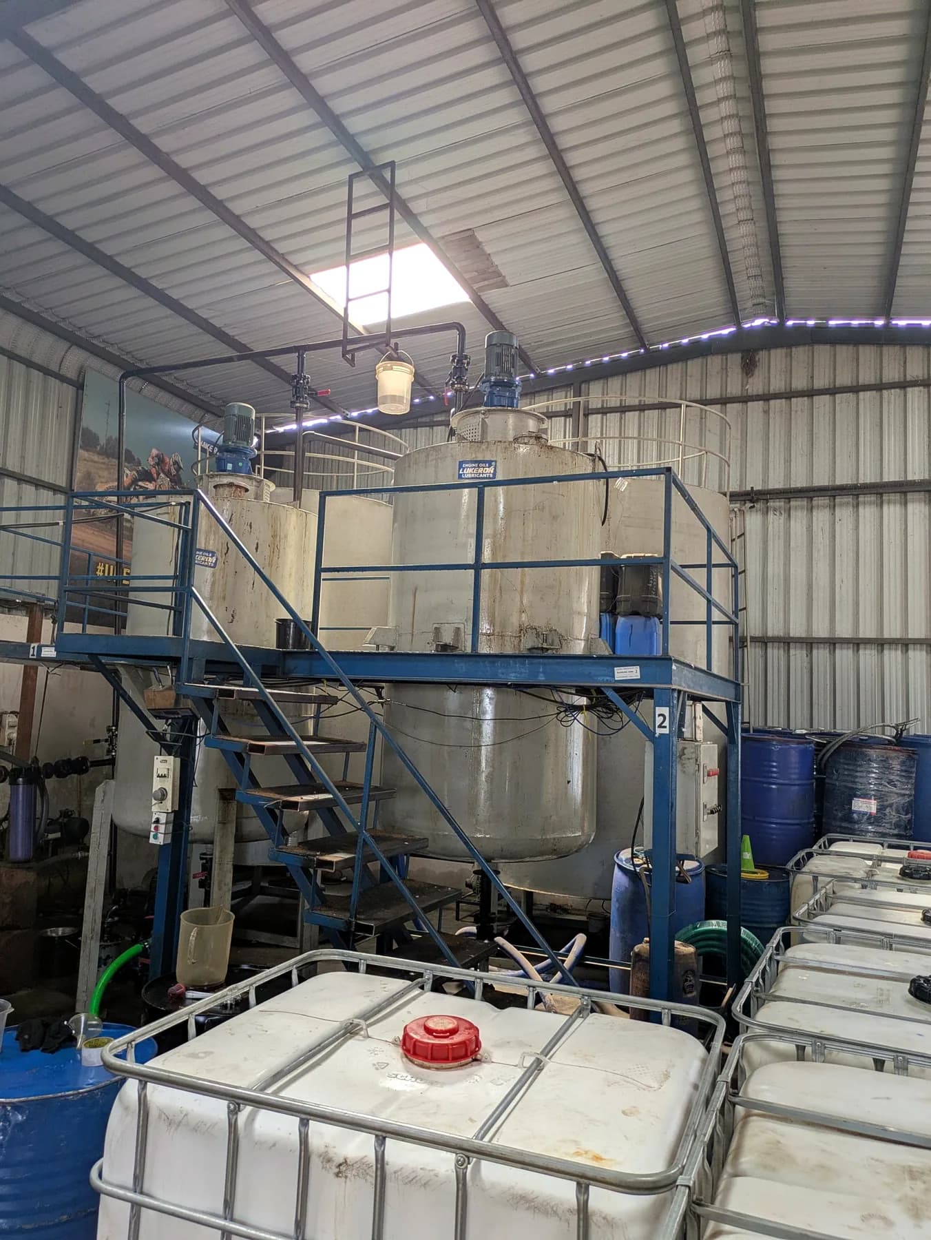 Blending tanks with mixers on a platform at the Lukeron plant